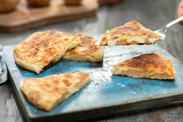 Delicious flatbread with potatoes and cheese.
