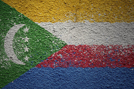 painted big national flag of comoros on a massive old cracked wall