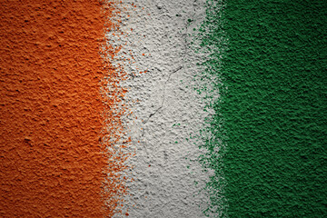 painted big national flag of cote divoire on a massive old cracked wall