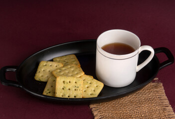 Crunchy  biscuit for healthy life with wheat and cup of tea for breakfast.