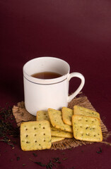 Crunchy  biscuit for healthy life with wheat and cup of tea for breakfast.