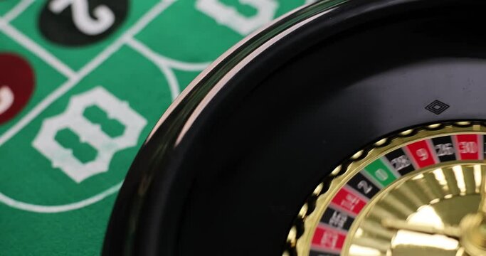 Online casino club and promotional gambling. Spinning roulette wheel and green field