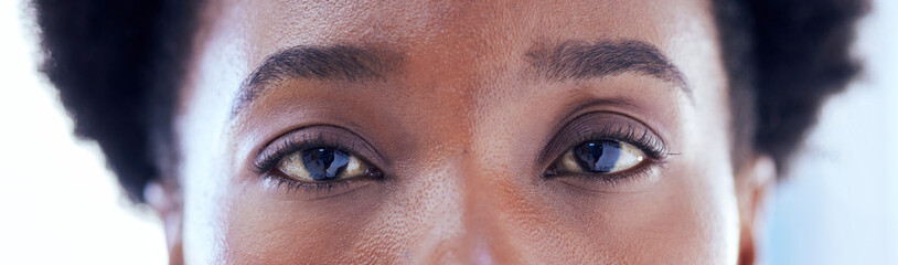 Fototapeta na wymiar Banner, closeup eyes and portrait of black woman with makeup, serious expression or clean eyebrow. Skincare, microblading and an African girl or model with cosmetics, eyeliner or looking with beauty