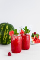 Watermelon lemonade with mint and watermelon on a white background