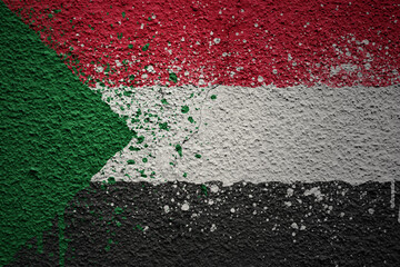 painted big national flag of sudan on a massive old cracked wall