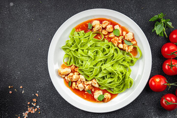 green tagliatelle pasta chicken tomato sauce vegetable food healthy meal food snack on the table copy space food background rustic top view