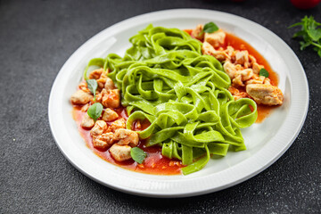 green tagliatelle pasta chicken tomato sauce vegetable food healthy meal food snack on the table copy space food background rustic top view