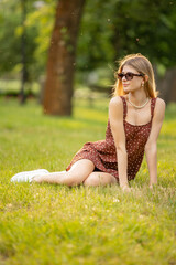 Naklejka na ściany i meble Young beautiful woman teen girl looking to side - outdoor in nature