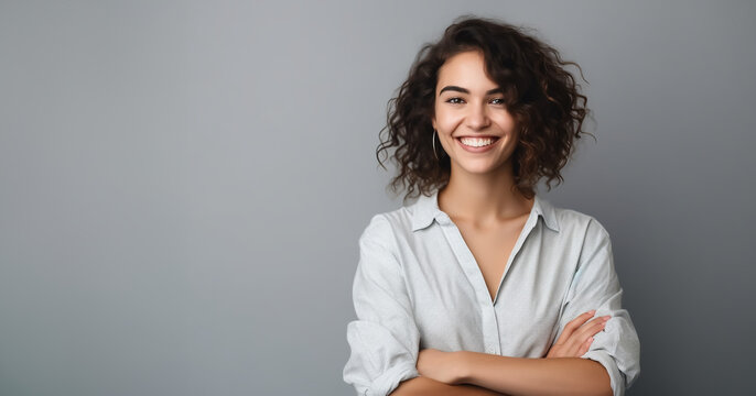 Young woman standing smiling in front of gray wall - space for text - theme student, education, info for customers - Generative AI