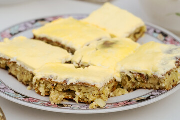 Traditional Bosnian savory pie - buckwheat pita ljevuša with feta cheese, zucchini and eggs