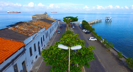 Obraz premium Aerial view of Monserrate historical buildings and pier with the sea in the background.