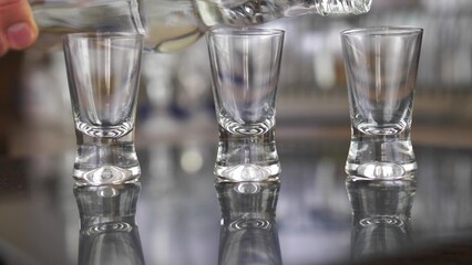 Pouring Vodka into Shot-Glasses Slow Motion