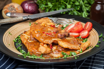 Potato pancakes with meat, vegetable, tomato and parsley.