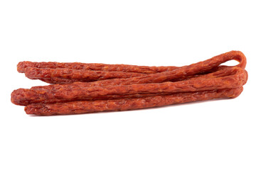 Long thin smoked sausage on a white background.