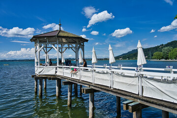 pier on Lake Constance in Bregenz (Austria) transformed into a bar on a summer day with blue skies...