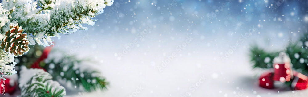 Poster Christmas widescreen blurred defocused background with branches covered with snow against the background of the evening sky and snowfall.