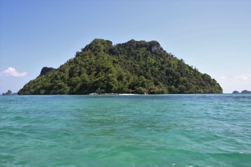 view to small rock islands surrounded by blue water