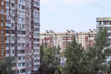 Fototapeta na wymiar Urban landscape. Sleeping area of the city, ghetto. Multi-storey houses, balconies. Ukrainian city, Kyiv. Postcard, photo, advertising, wallpaper, urban view.