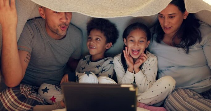 Scared family, children and technology, watching horror movie at night, streaming show in bedroom at home. Mom, father and kids in bed to watch movies, relax and bonding with online thriller video.