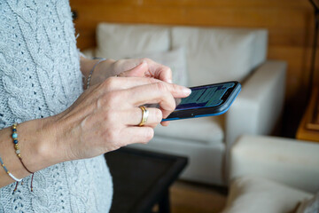 Woman typing on her smart phone