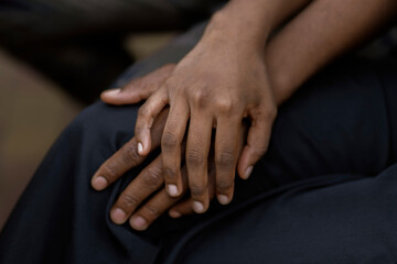 black couple in love hold each other hand, symbol of support trust and empathy