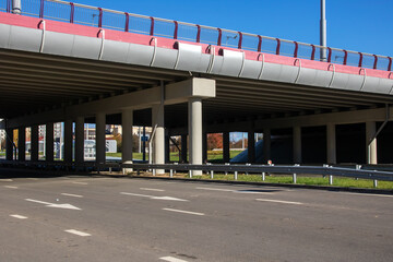 Bridge over a wide road in sunlight