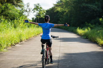 Riding bike in summer forest
