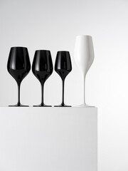 Black and white glass goblets on a white background