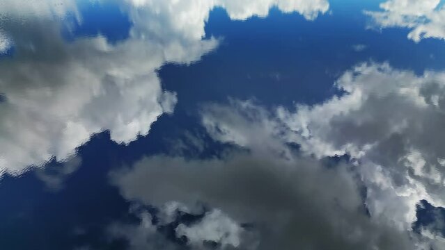 Aerial top view of blue sky with clouds reflection in water of lake, abstract background, timelapse 4k