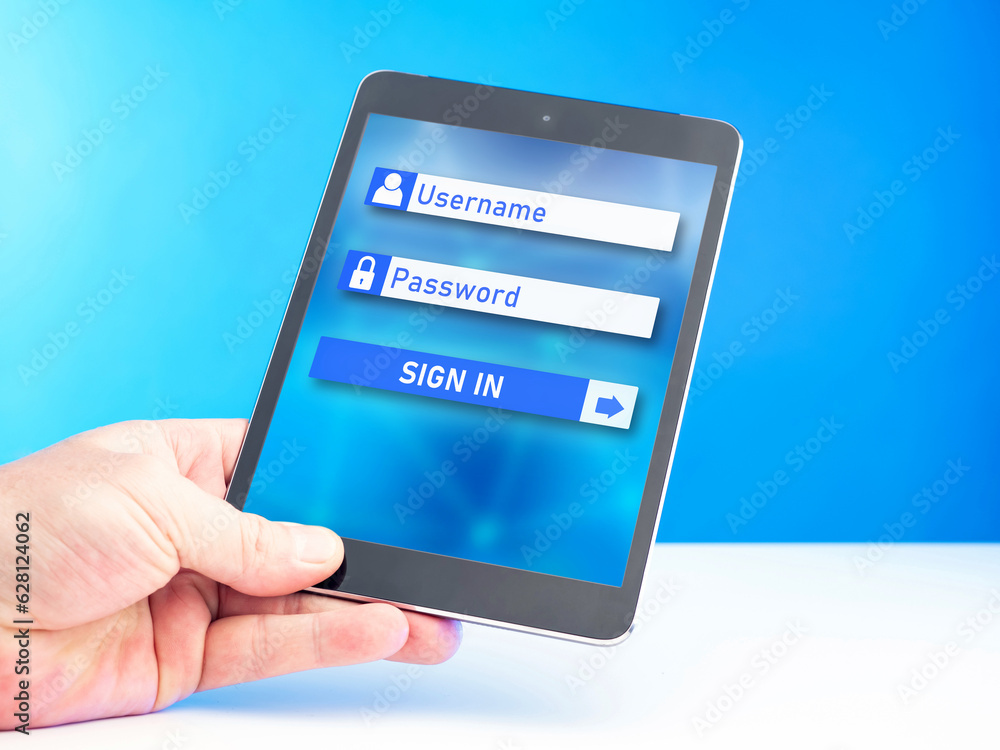 Poster website login form. electronic tablet in hand. place to enter username and password. internet author