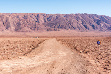 Desertic road to Baltinache hidden lagoons in Atacama desert