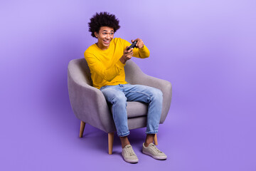 Full length portrait of excietd funky person hold controller play video games look empty space...