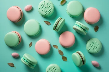Foto auf Acrylglas Macarons Green and pink macarons on turquoise background. Generative AI