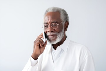 Portrait of a middle-aged man with glasses, wearing a white shirt on a white background.