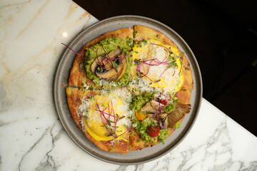 Puff pastry pizza with baked vegetables and mushrooms