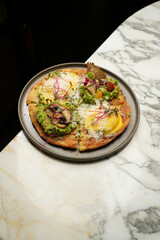 Puff pastry pizza with baked vegetables and mushrooms