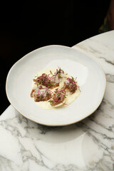 Ravioli with baked duck and cream sauce