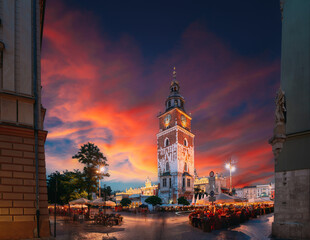 Krakow, Poland. Famous Landmark On Old Town Square In Summer Evening. Old Town Hall Tower In Night...