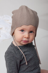 Little girl with knitted hat looking at camera