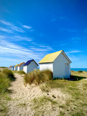 Fototapeta na wymiar colored beach huts at the beach