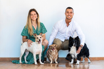 Husband and wife with three dogs - Powered by Adobe
