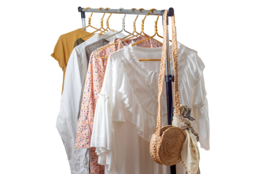 Second-hand clothes  on the rail. The concept of sustainable economic life. Sale of clothes. Summer women's clothing on the swap. Clothing store