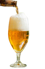 Light beer is poured from a bottle into a glass