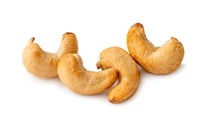 Roasted brown cashew nuts in stack isolated on white background with clipping path and shadow in png file format