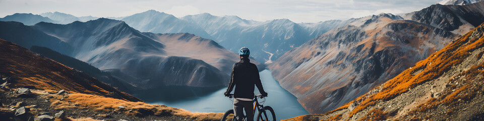 cyclist at the edge of the cliff and mountain view - obrazy, fototapety, plakaty