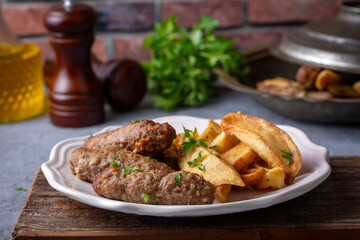 Traditional Turkish food; dry meatballs or inegöl meatballs with potatoes (Turkish name; Kuru kofte or anne koftesi)