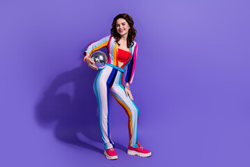 Photo of positive cheerful lady hold discoball party dj for having fun isolated on purple color background