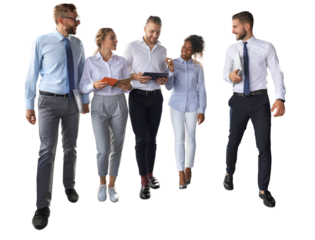 Modern business people discussing business and smiling while walking through the office corridor