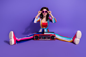Full length photo of cool charming lady wear striped overall enjoying boom box discotheque songs isolated purple color background