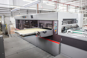 The equipment for a press. Offset machine at the printing manufacturing. Printing machine